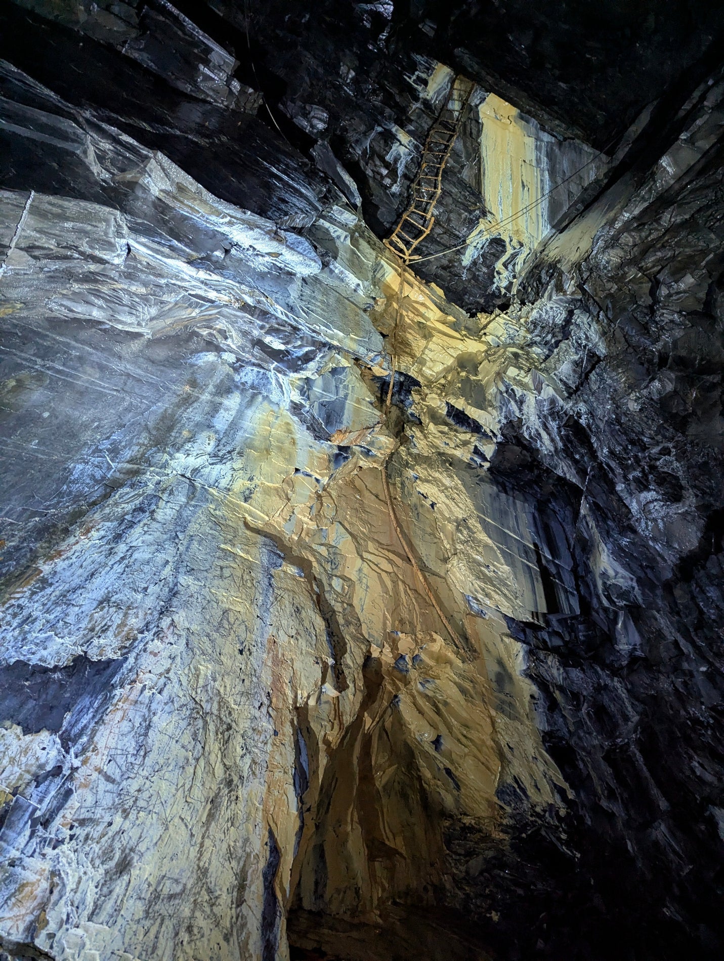Beautiful mineral deposits covering a wall in Cwmorthin Slate Mine